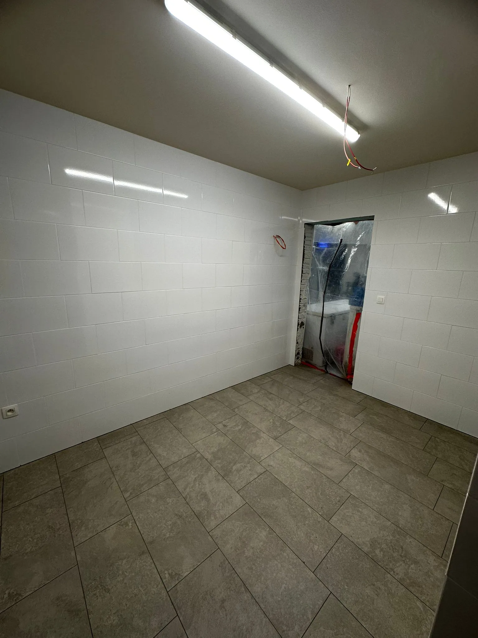 Tiled space with light walls