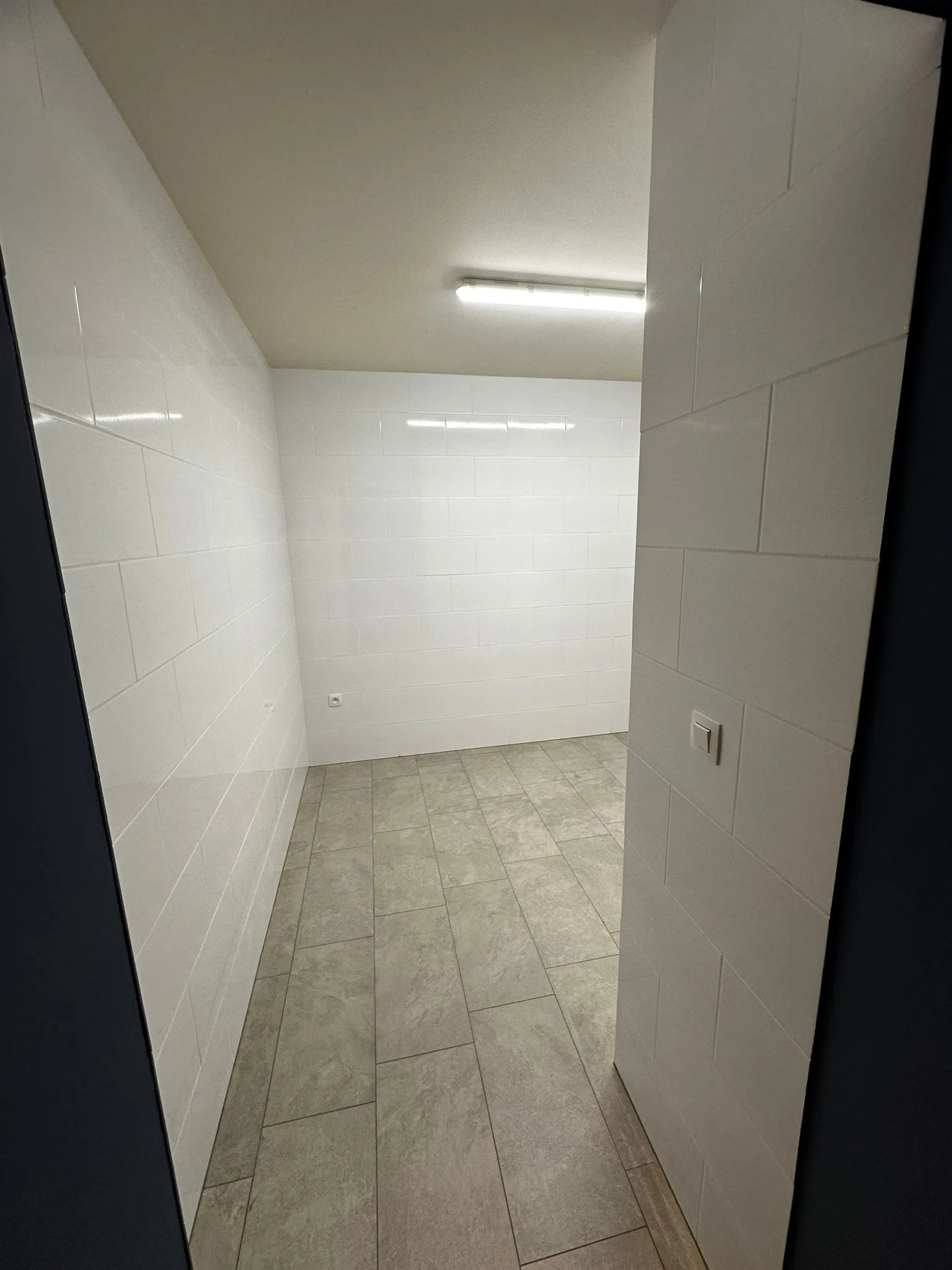 Tiled space with light walls