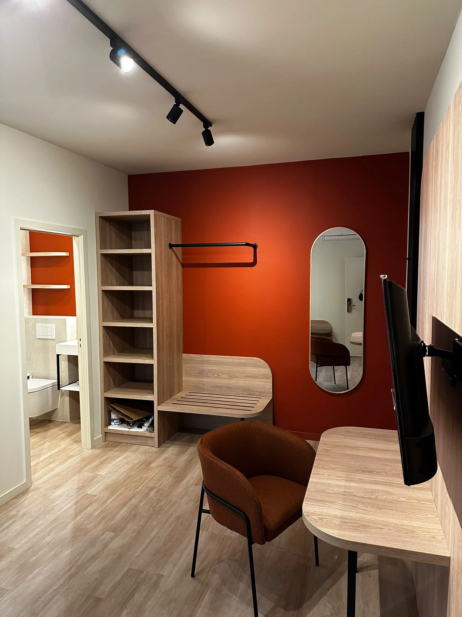 Open storage, luggage bench and terracotta wall