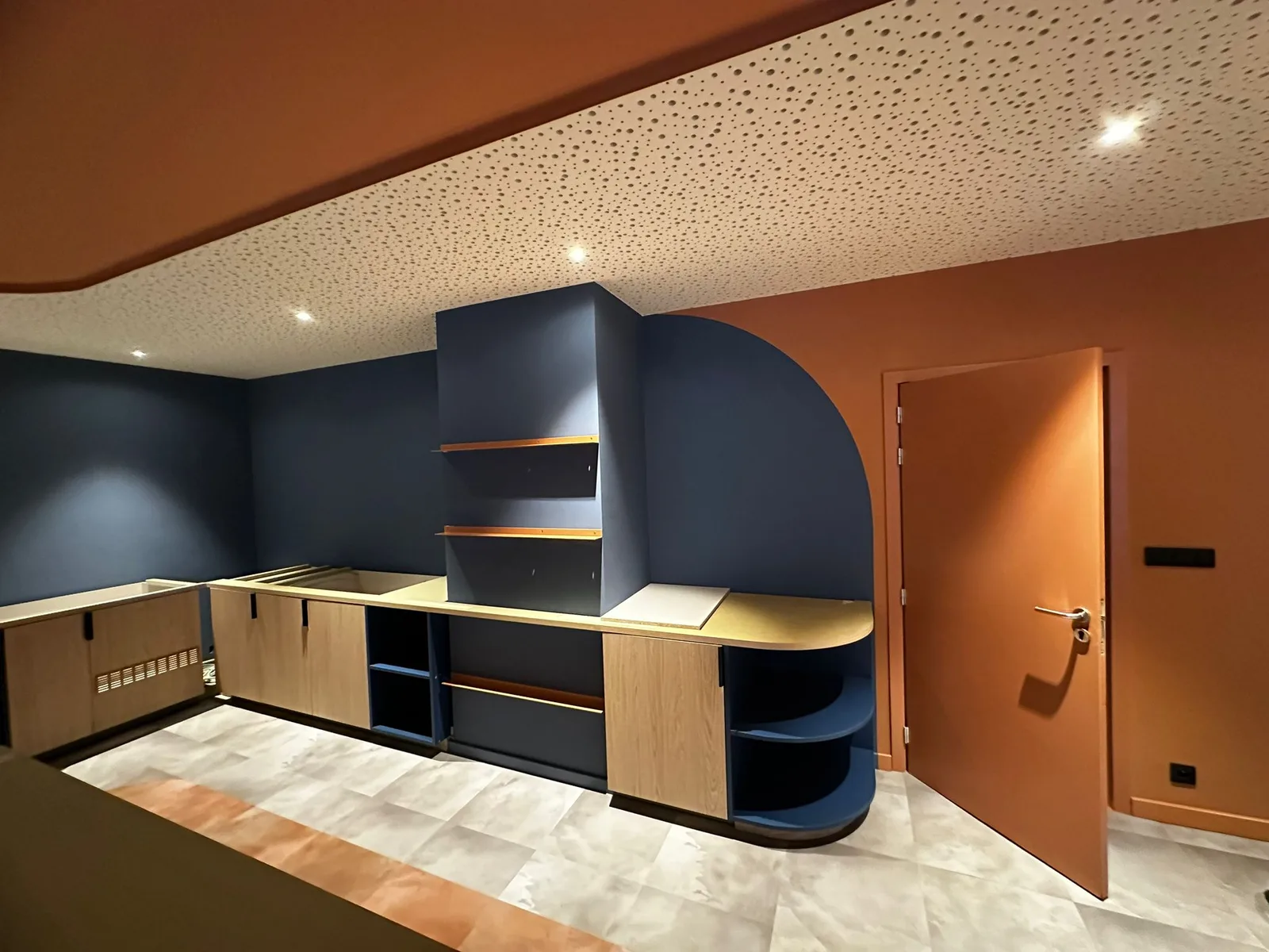 Hotel interior with blue and terracotta accents