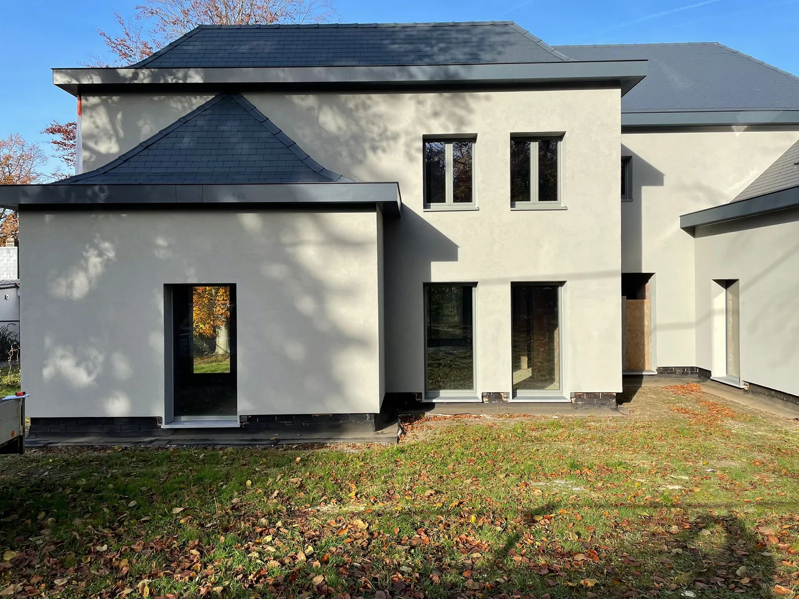 Light facade with dark window frames