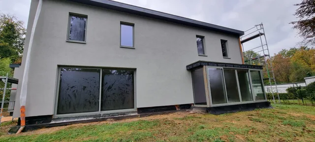 Light facade with dark window frames