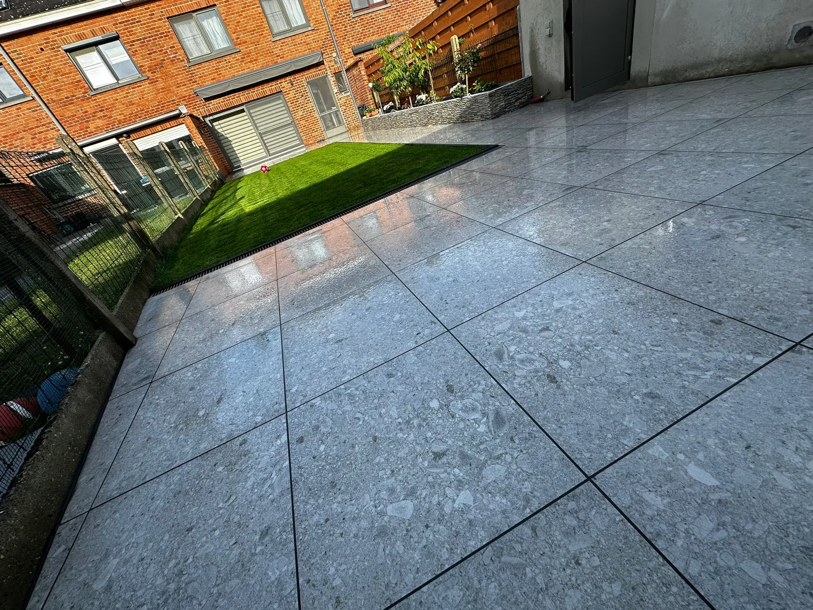 Terrace with large grey tiles