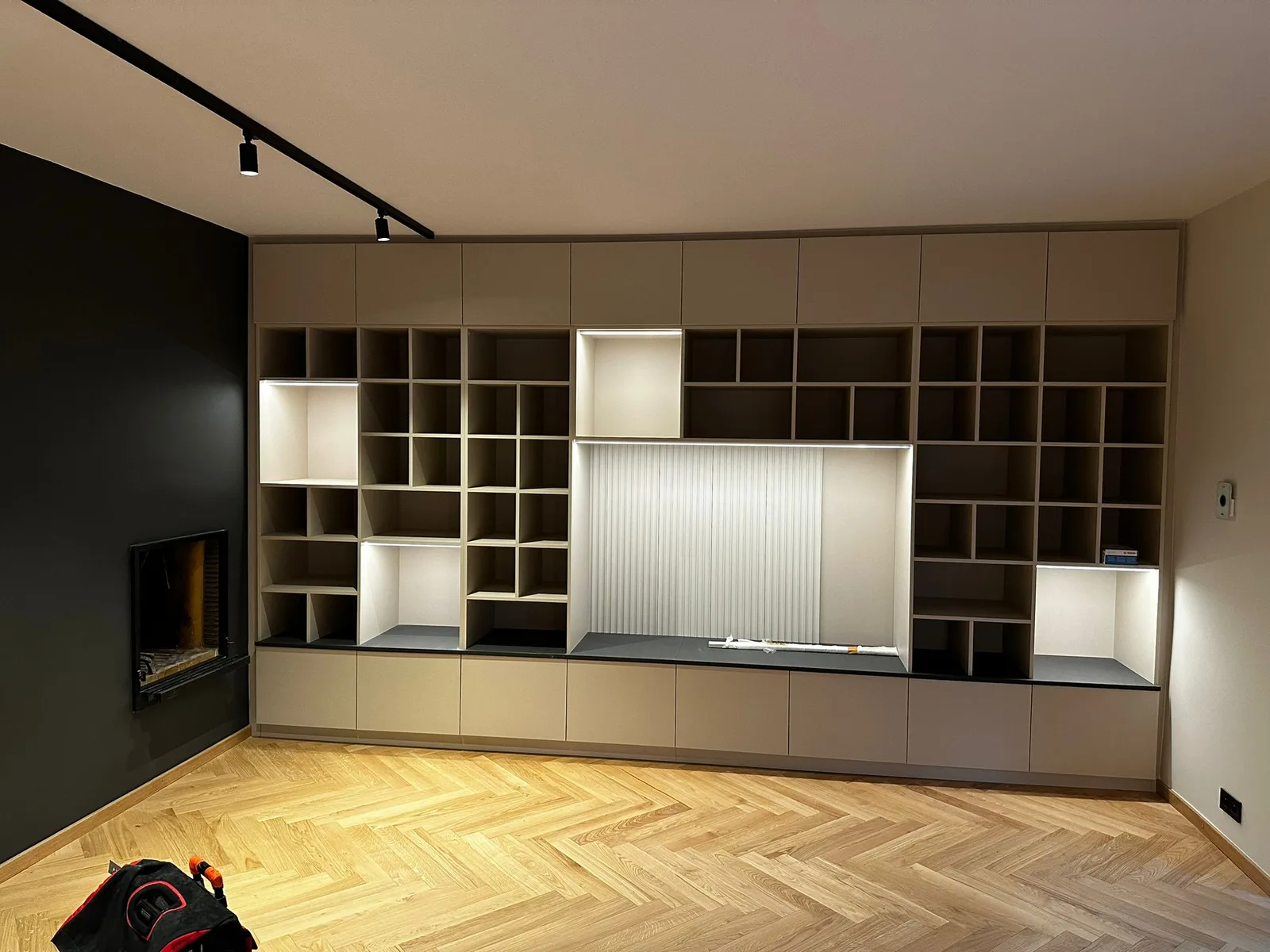 Kitchen and storage with herringbone-pattern flooring