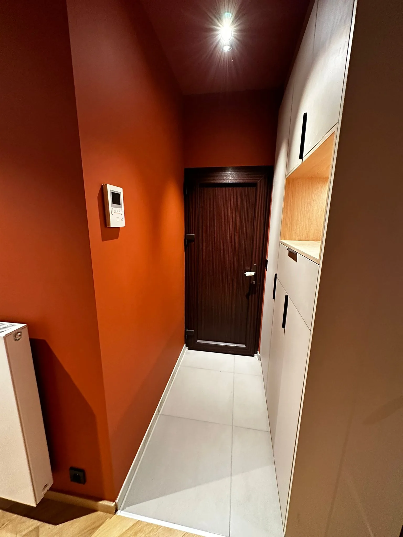Passage and interior room with coordinated finishes