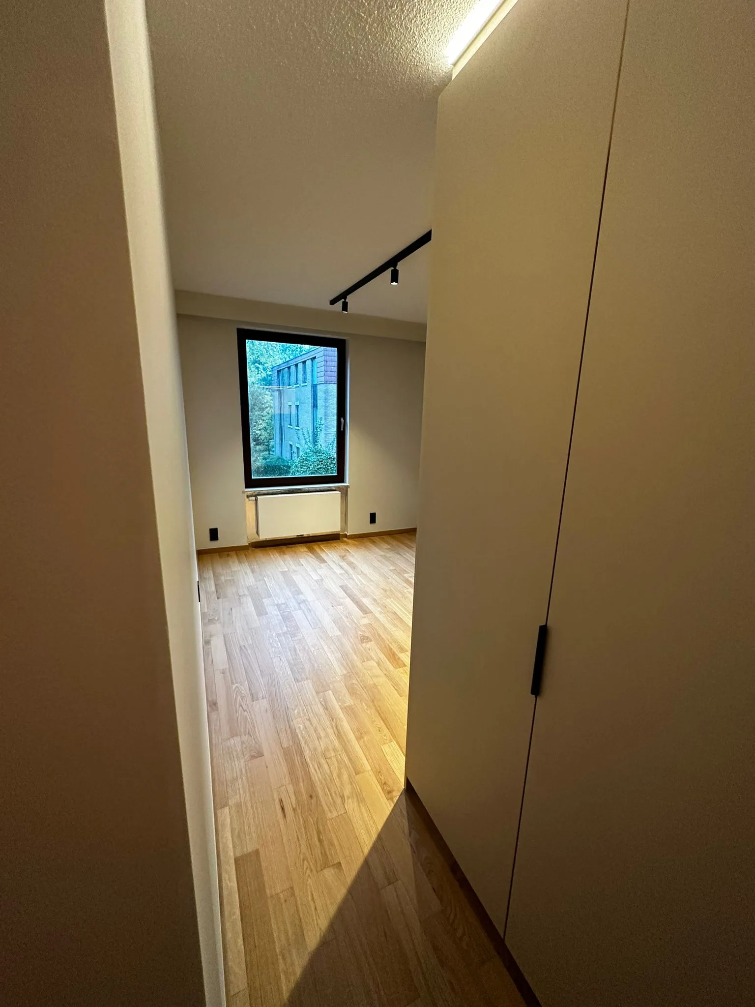 Passage and interior room with coordinated finishes