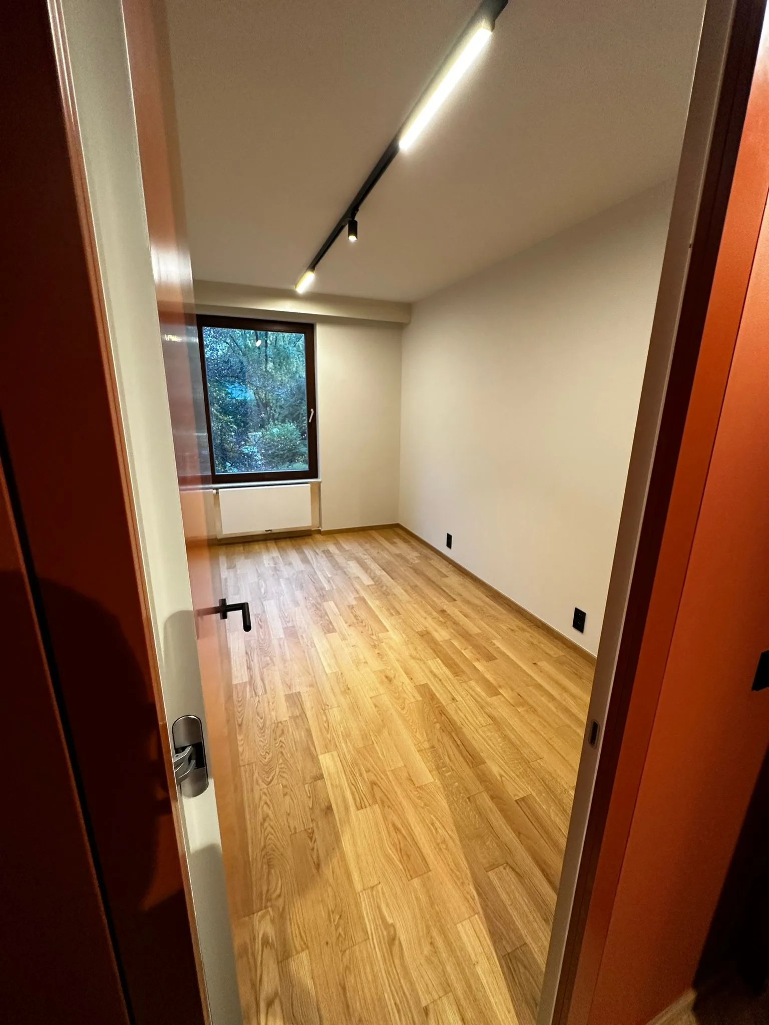 Passage and interior room with coordinated finishes