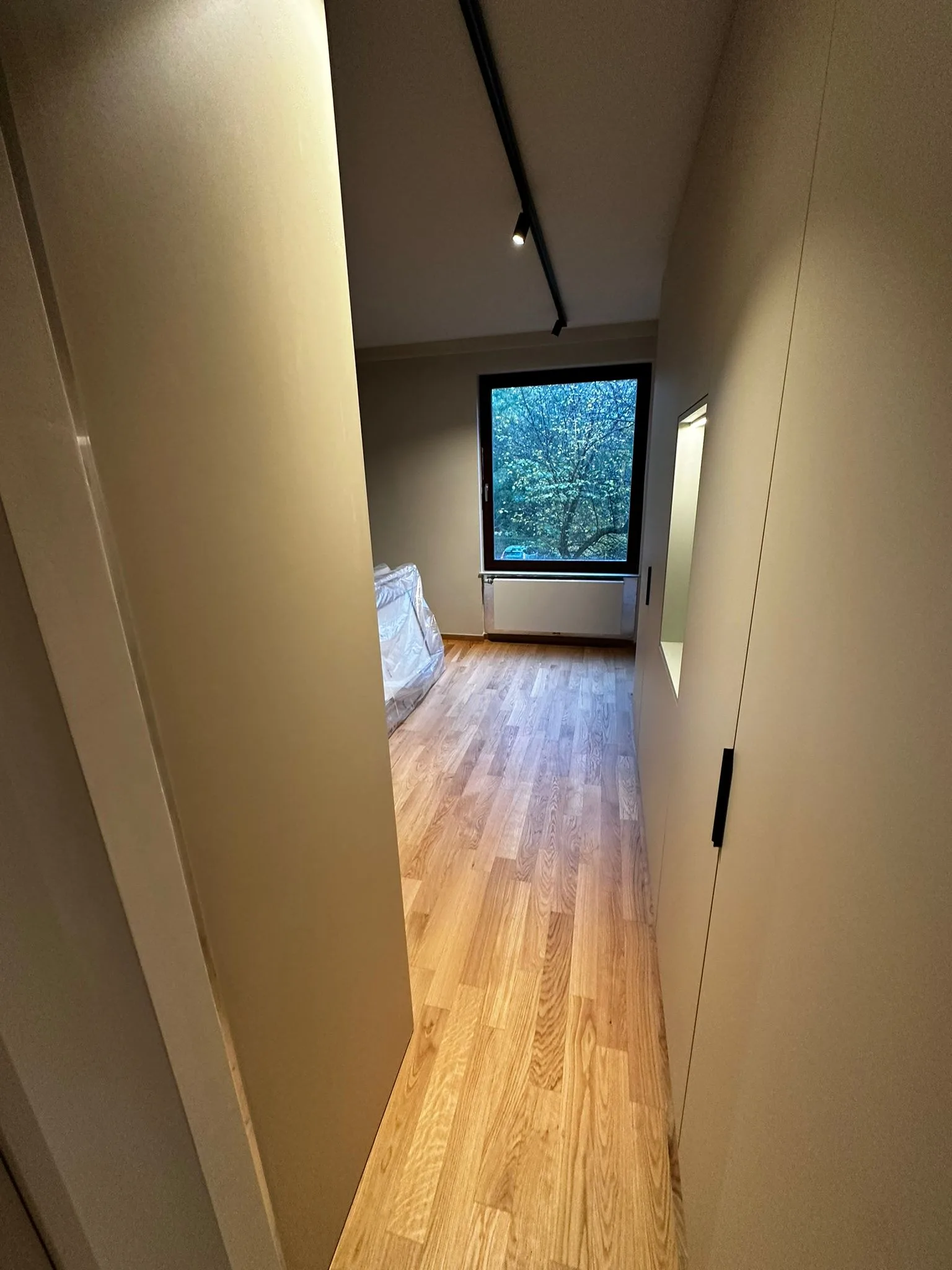 Passage and interior room with coordinated finishes
