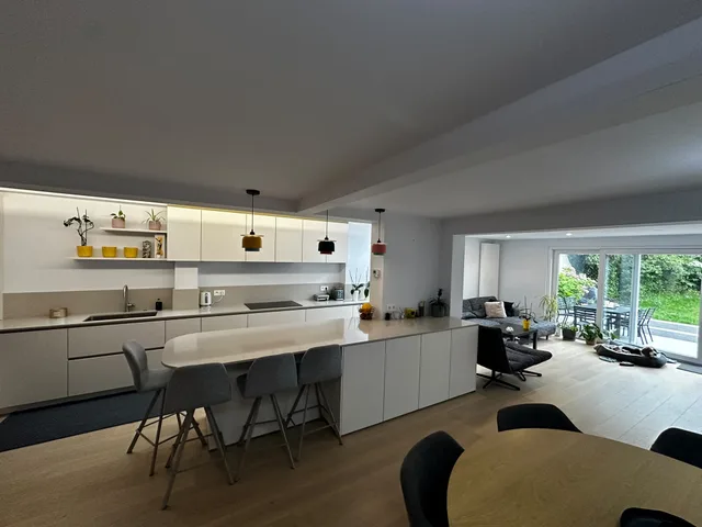 Open kitchen with an island and garden-facing living area