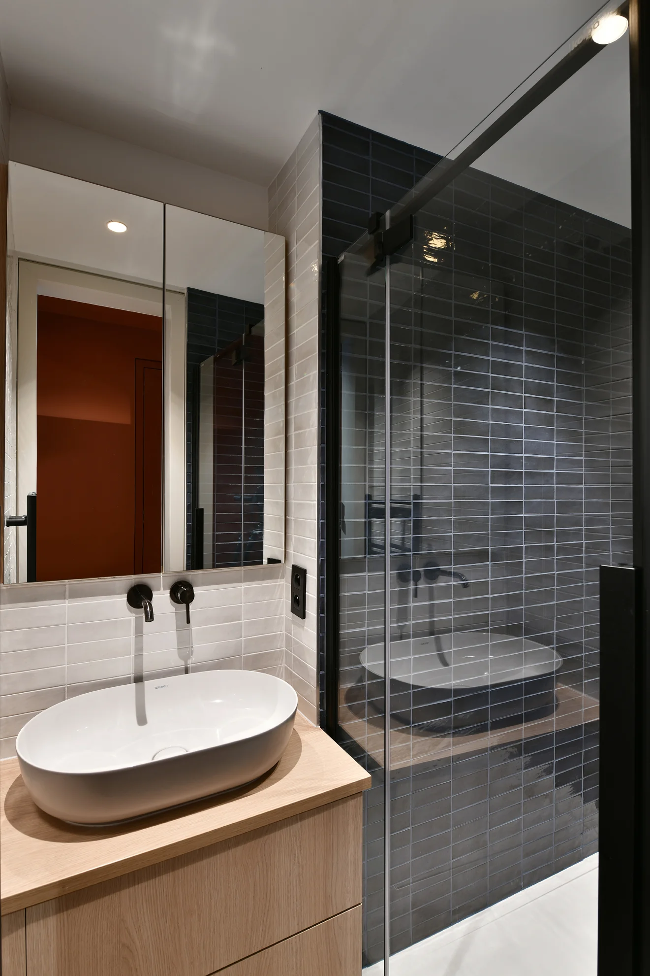 Bathroom with a basin, mirror and glazed shower